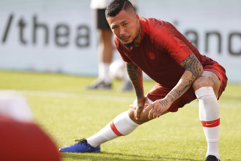 Chinese footballer Zhang Linpeng​ has been told to cover his tattoos