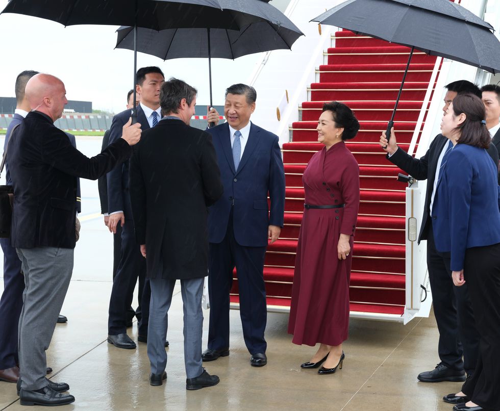 Chinese President Xi Jinping and hi wife are received by French Prime Minister Gabriel Attal at Paris Orly airport upon arrival.