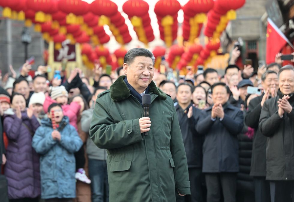 Chinese President Xi Jinping visiting an ancient cultural street in north China's Tianjin Municipality ahead of the Spring Festiva.