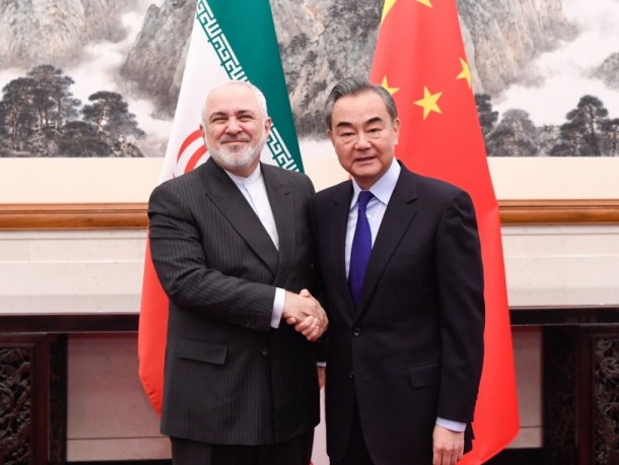 Chinese State Councilor and Foreign Minister Wang Yi holds talks with Iranian Foreign Minister Mohammad Javad Zarif in Beijing, capital of China.