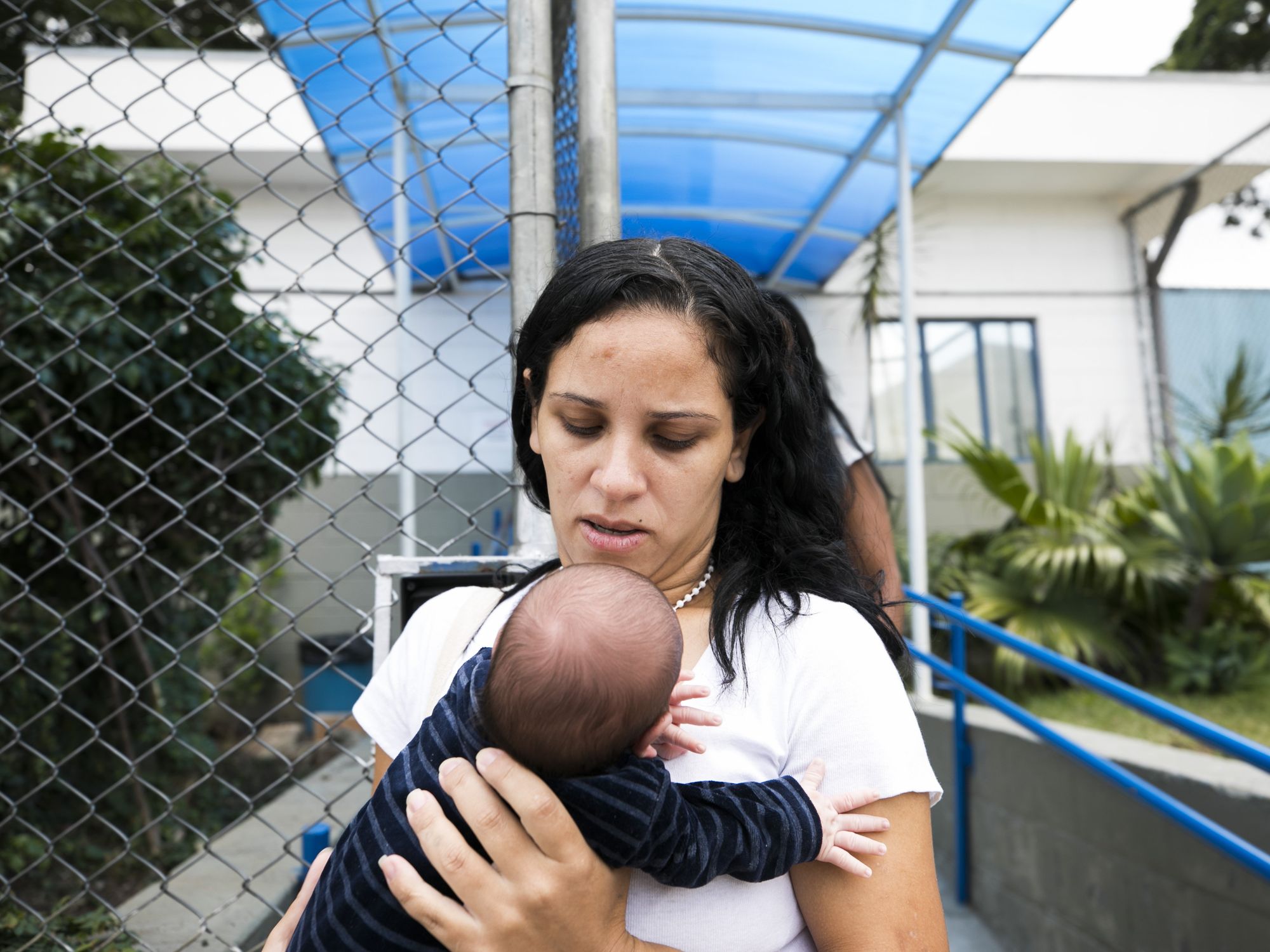 Christiane Ferreira Pinto and her son getting out of prison.