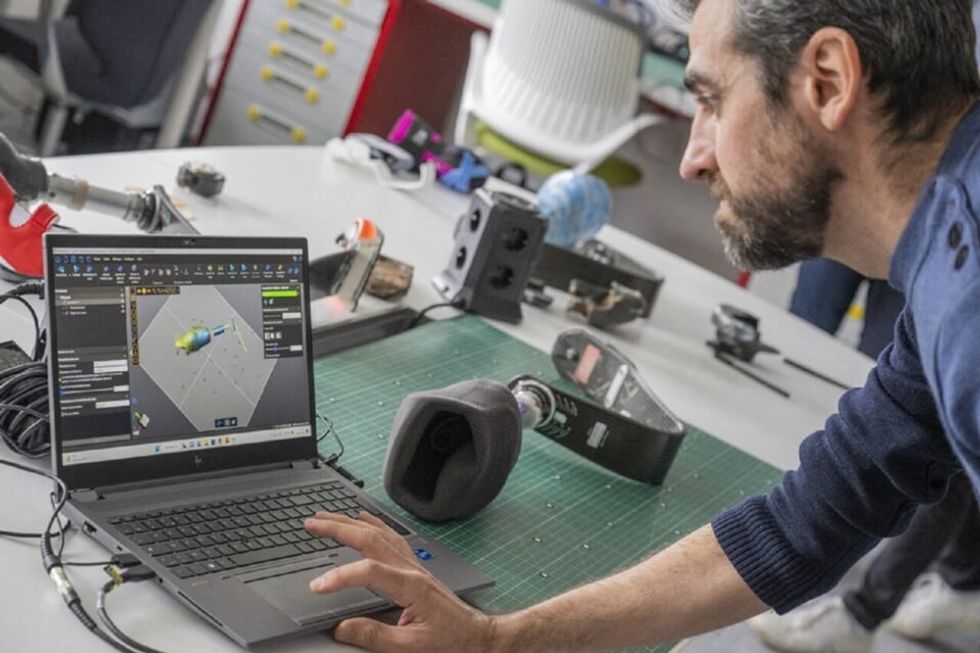 Christophe Debard working at Airbus' lab to design equipment designed for athletes with disabilities.