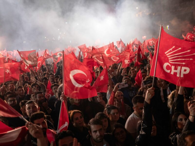 Citizens shout slogans and wave Turkish and CHP party flags during the election victory celebration.