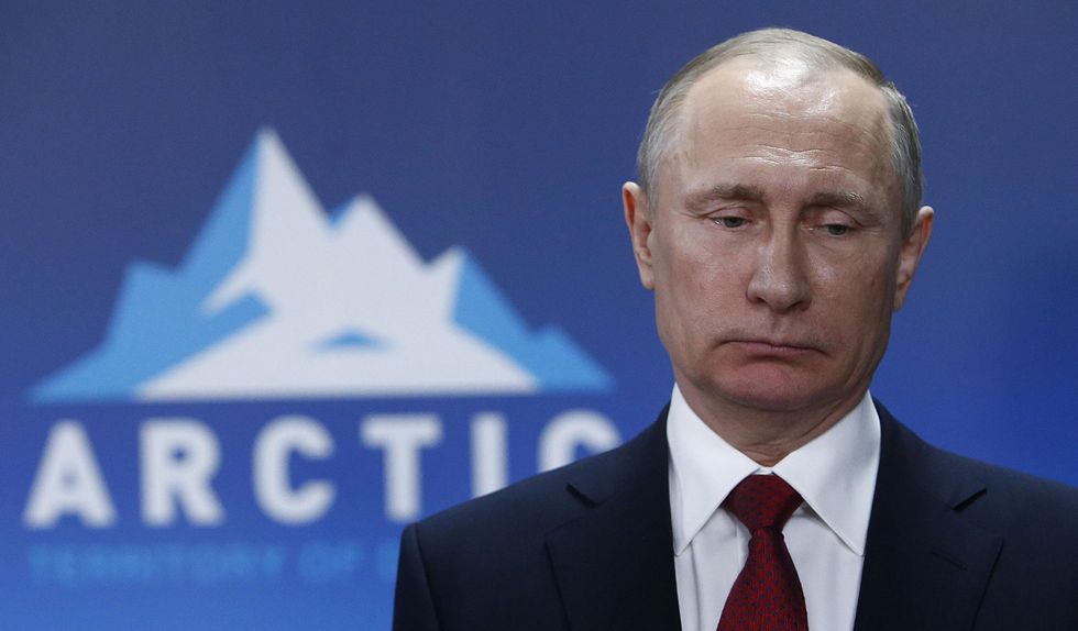 Close-up photo of ​Russian President Vladimir Putin after a meeting with President of Iceland Gudni Johannesson at sidewalks of the International Arctic Forum in Arkhangelsk, Russia