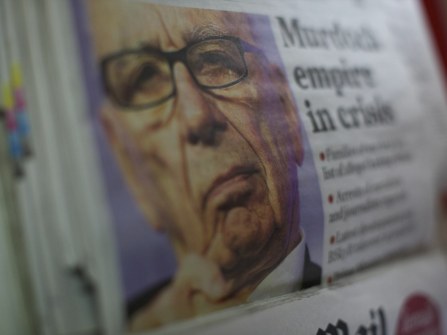 Close up photograph of a opy of The Independent features Rupert Murdoch striking a pensive countenance as his 'News of the World' tabloid newspaper announced its last edition will run