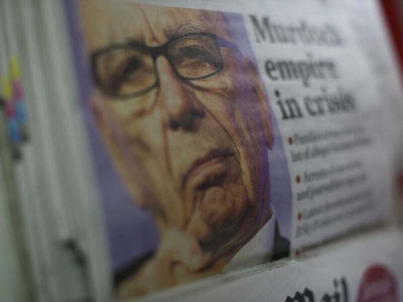 Close up photograph of a opy of The Independent features Rupert Murdoch striking a pensive countenance as his 'News of the World' tabloid newspaper announced its last edition will run