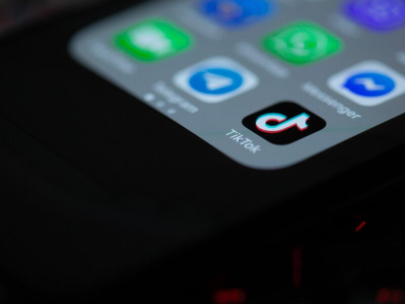 Closeup photo of a smartphone displaying the TikTok app icon