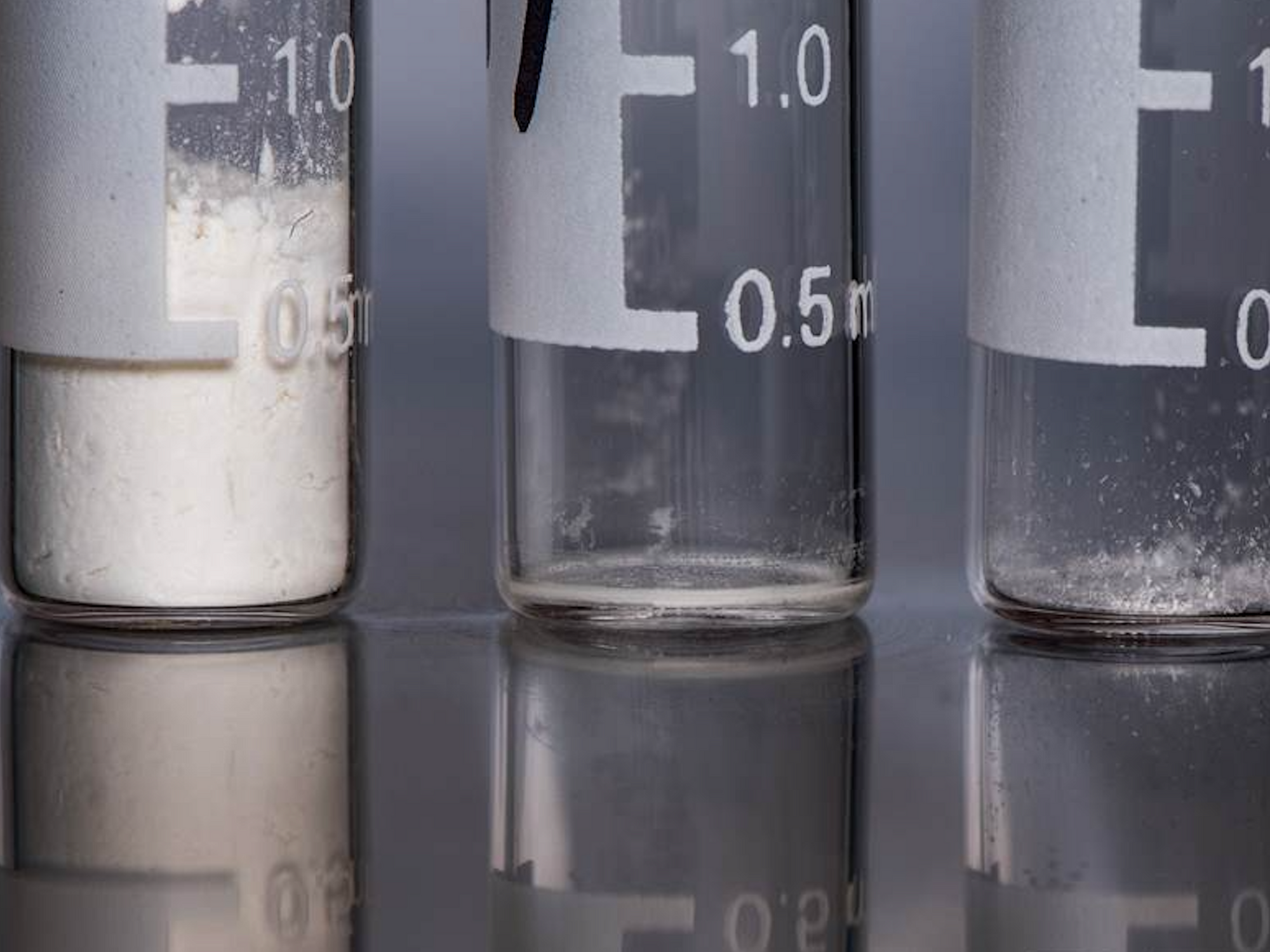 Closeup photo of three test tubes containing heroin, carfentail and fentanyl