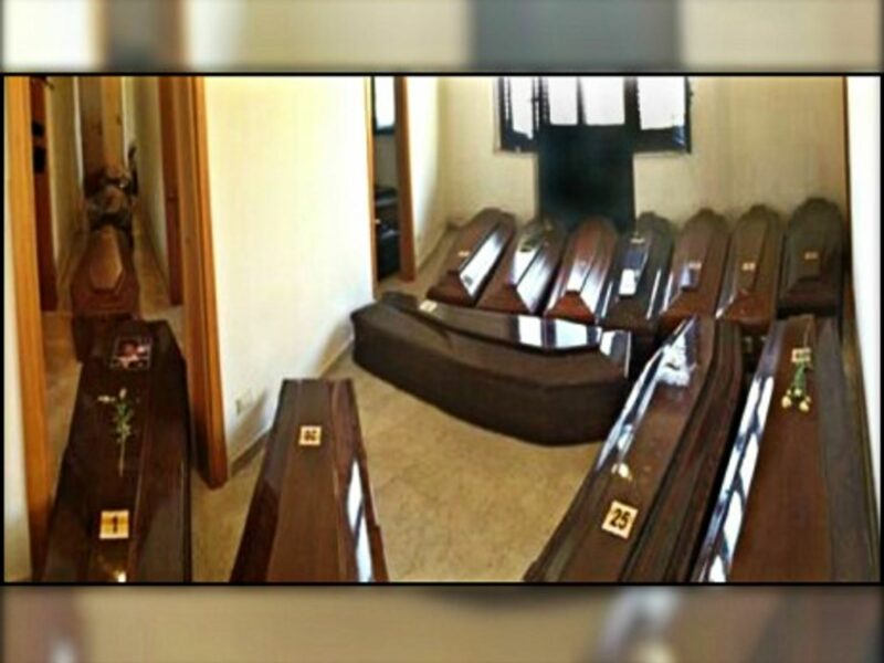 Coffins lined up side by side in Lampedusa