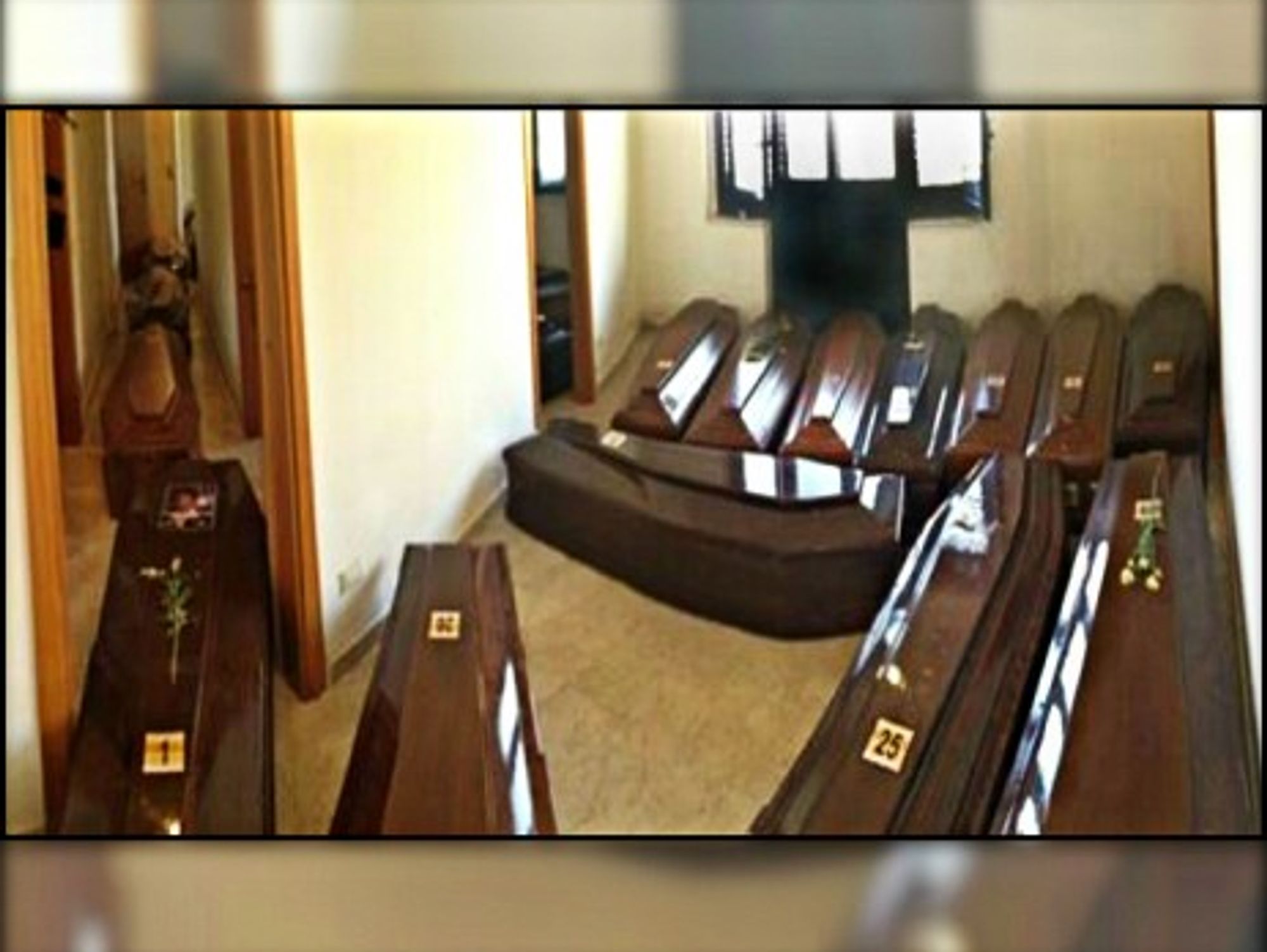 Coffins lined up side by side in Lampedusa