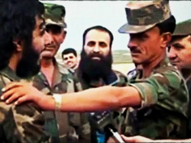 Colonel Suhail al-Hassan (rt) greeting troops