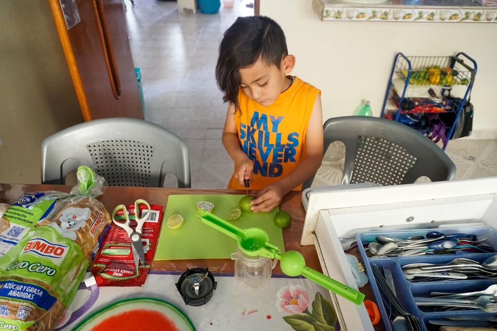 Cosme Damián Peña Suárez del Real learns math and fractions through daily activities, such as buying fruits and vegetables at the supermarket and helping in the kitchen.
