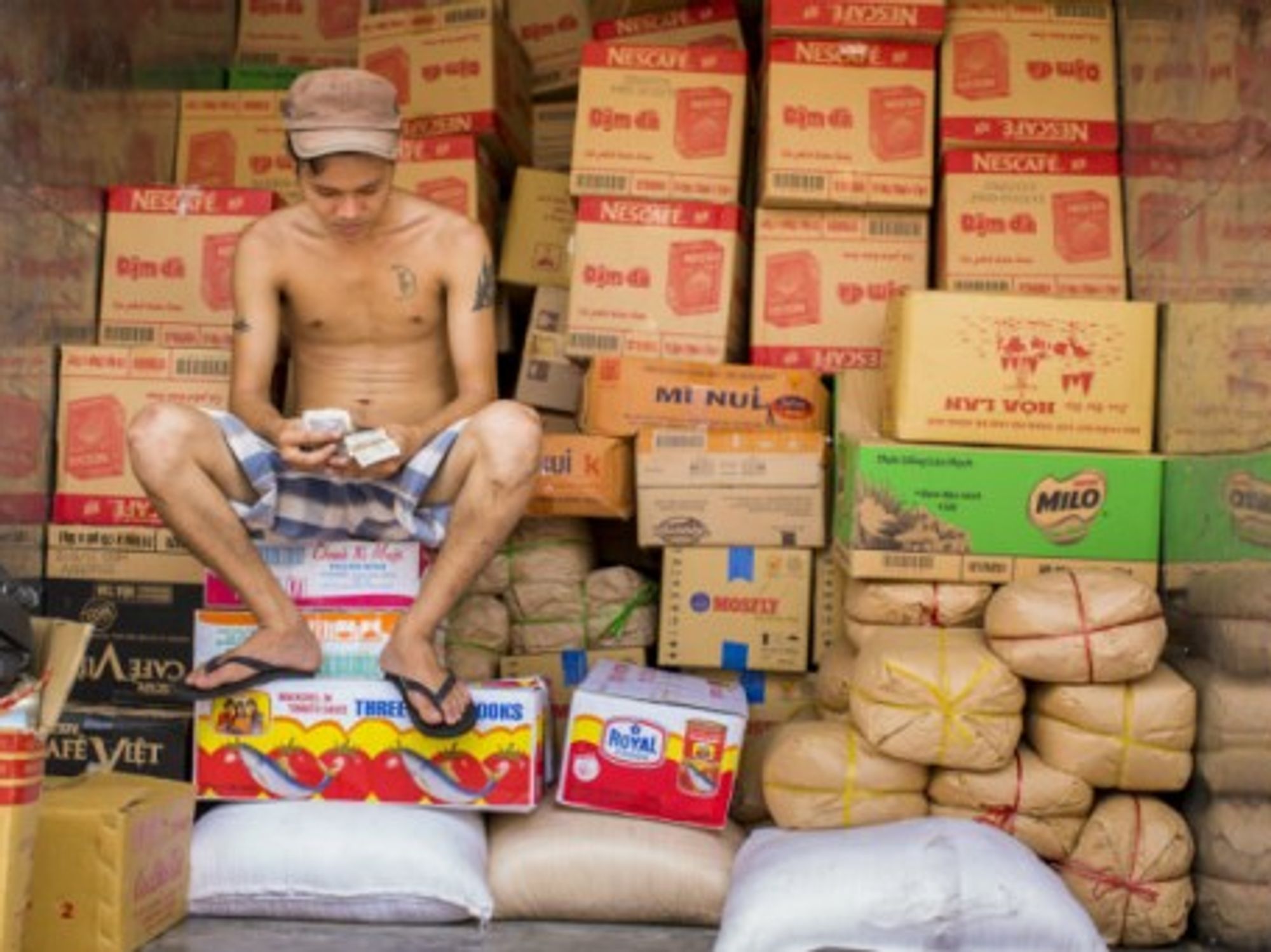 Counting cash in peaceful Ho Chi Minh City, Vietnam