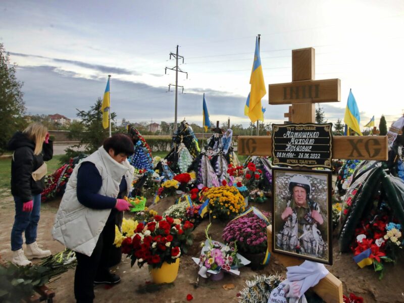 Covered by flowers graves of soldiers who died defending Ukraine at the cemetery of Bucha, near Kyiv.