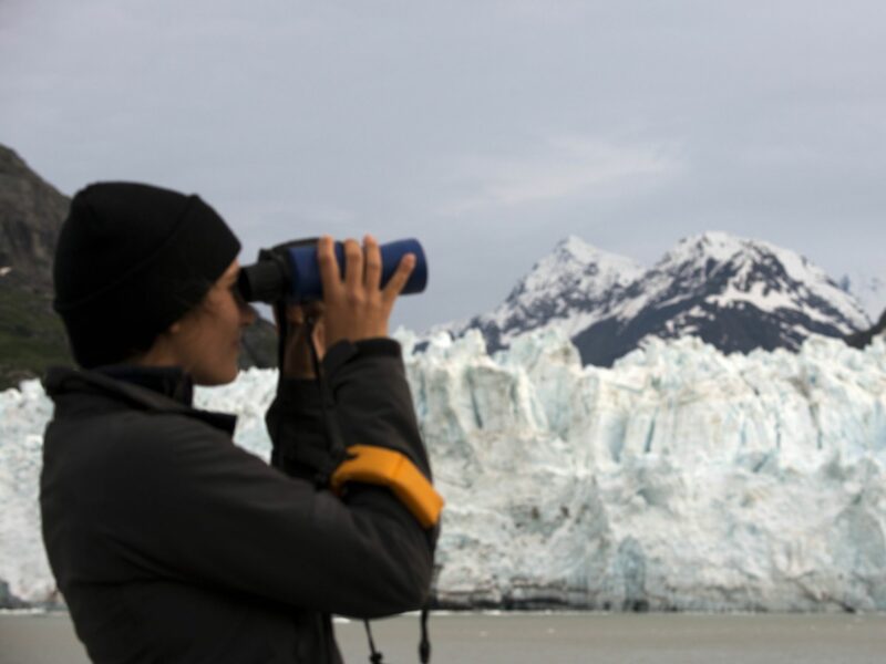 Crew with binoculars on cruise ship Safari Endeavour at the Margerie Glacier and Mount Fairweather in Glacier Bay National Park Alaska USA. Tarr inlet in Glacier Bay National Park. Margerie Glacier is a 21-mile-long (34 km) tide water glacier in Glacier Bay in Alaska and is part of the Glacier Bay National Park and Preserve