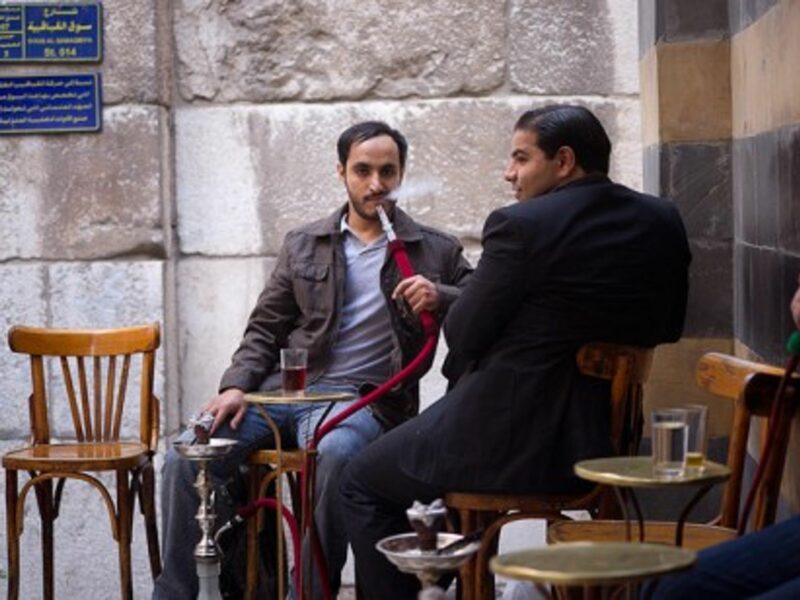 Customers in a Damascus café. Waiters are known to collect information overheard from clients.