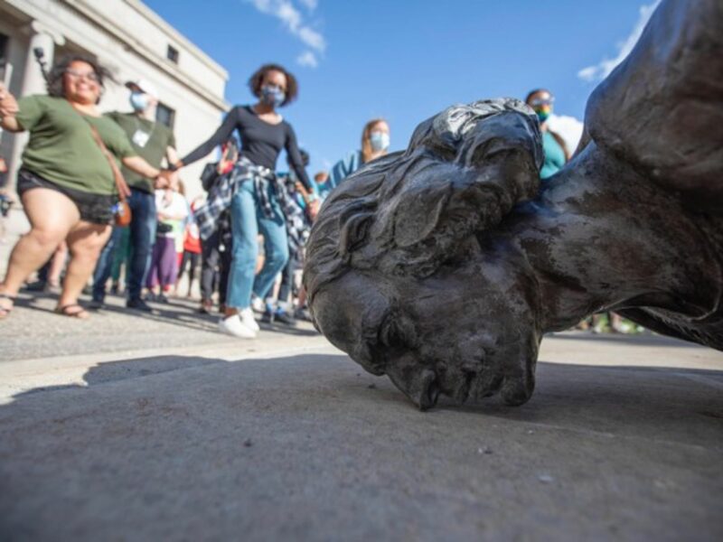Dacing around the torn down Christopher Columbus statue in St Paul, U.S.
