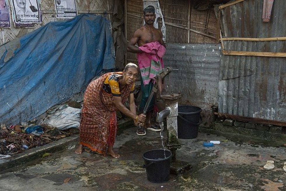 Dalit Hindu women gathering water.