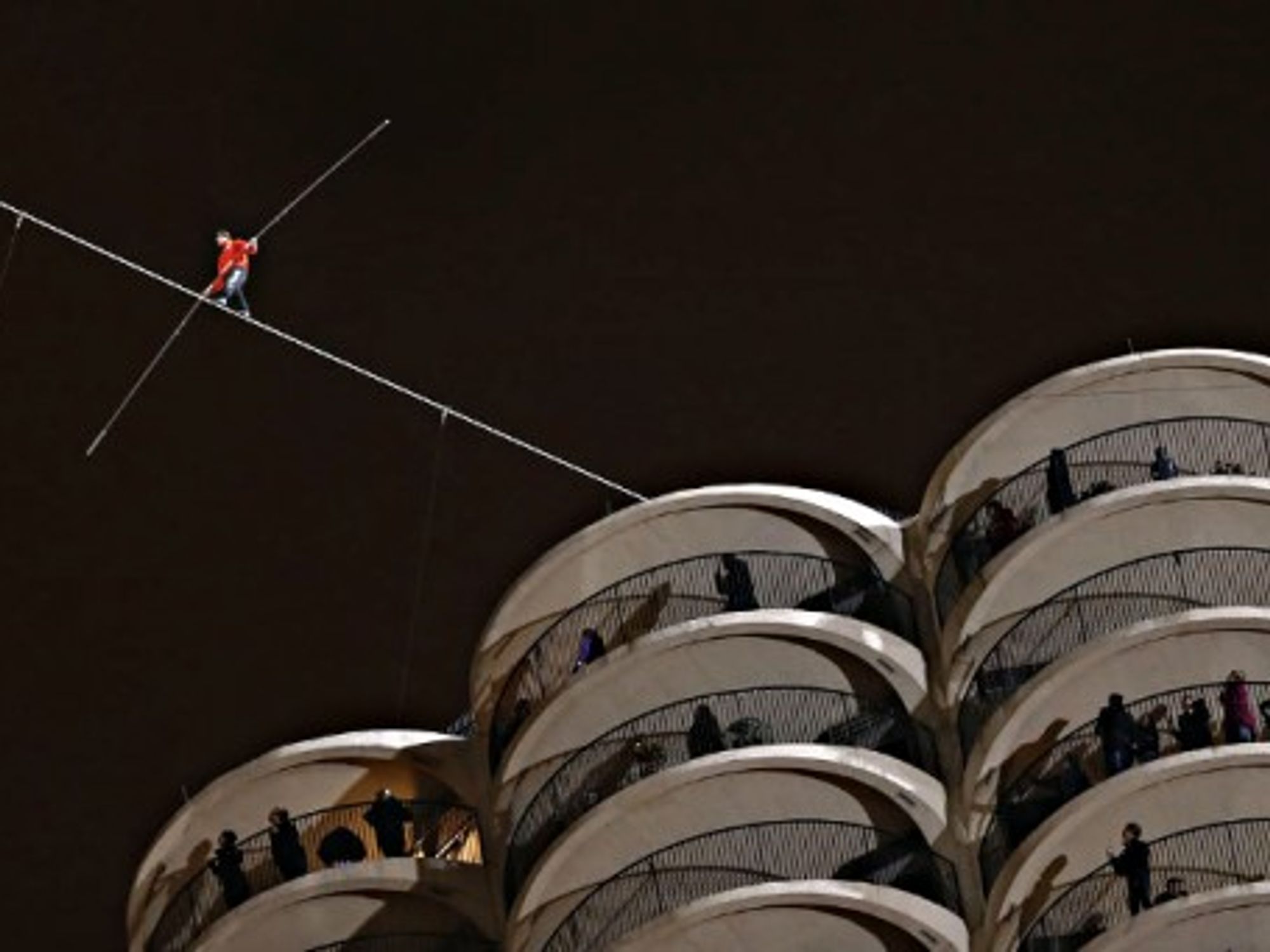 Daredevil Nik Wallenda walking a tightrope Sunday in Chicago