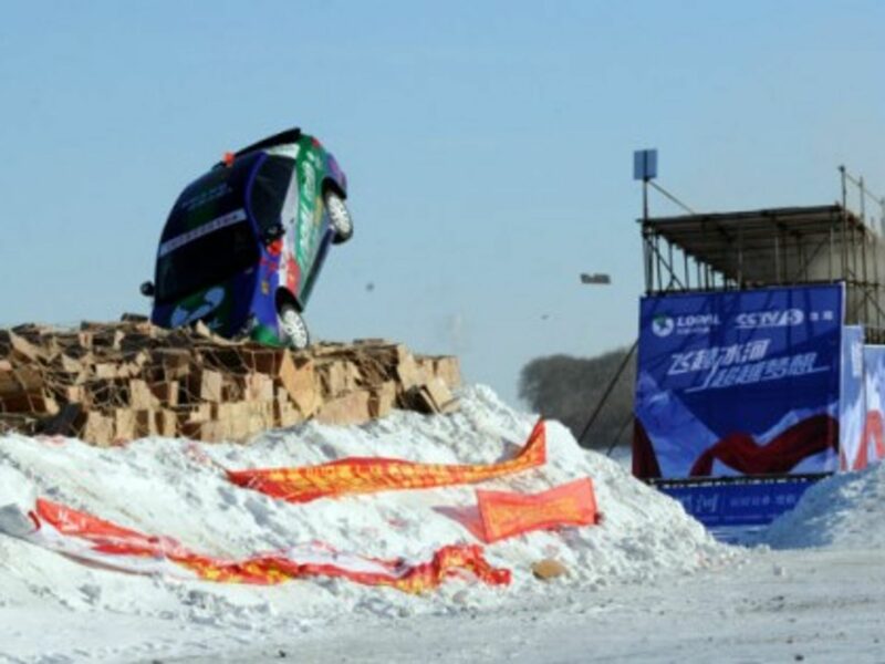 Daredevil Xie Yujun leaps over the frozen Heilongjiang River in a stunt car in Heihe, in China