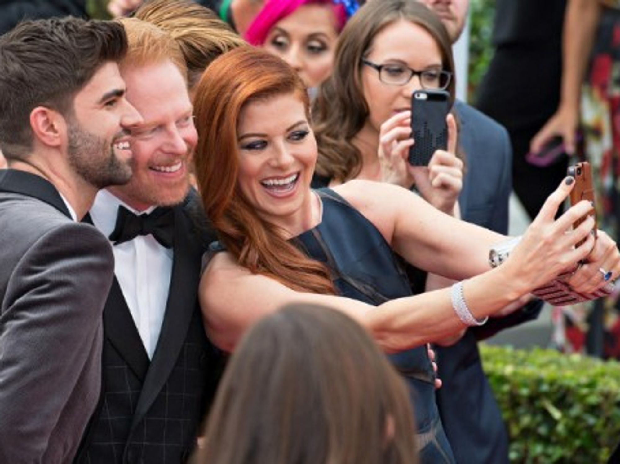 Debra Messing, Jesse Tyle and Justin Makita's snap selfie at the 2014 Emmy Awards