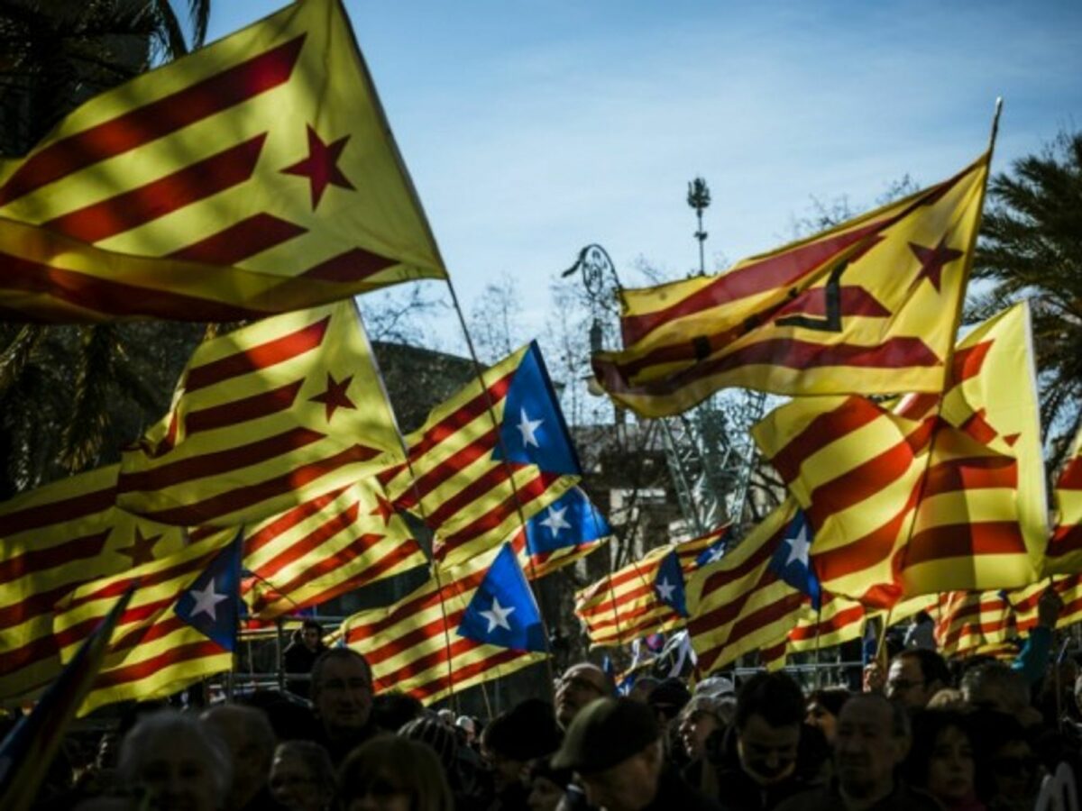 Demonstrators fly the Estelada, the unofficial flag of independent Catalonia, in February.