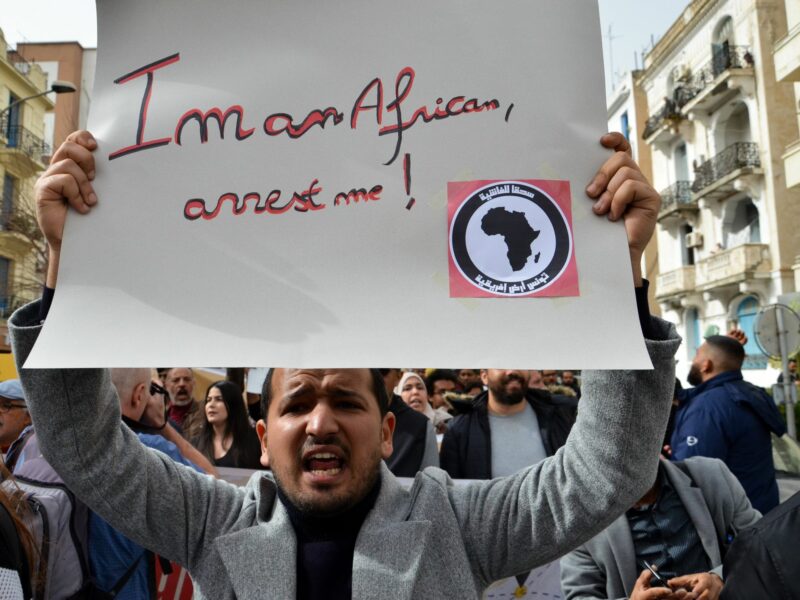 Demonstrators in Tunis holding a banner saying "I'm an African, arrest me !" in a fight against racism in the country and against President Kais Saied