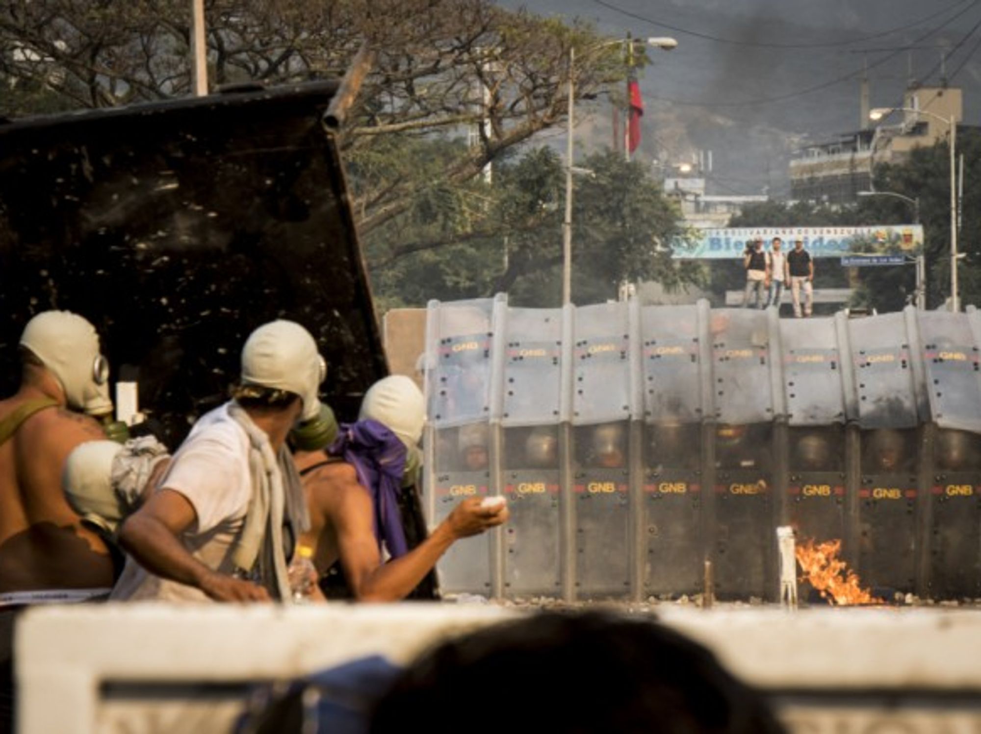 Demonstrators throwing stones in clashes in Colombia