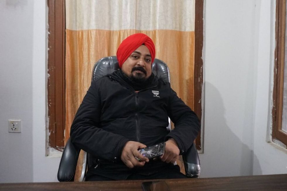 Dentist Bhupendra Singh Sodi poses for a portrait in his office.