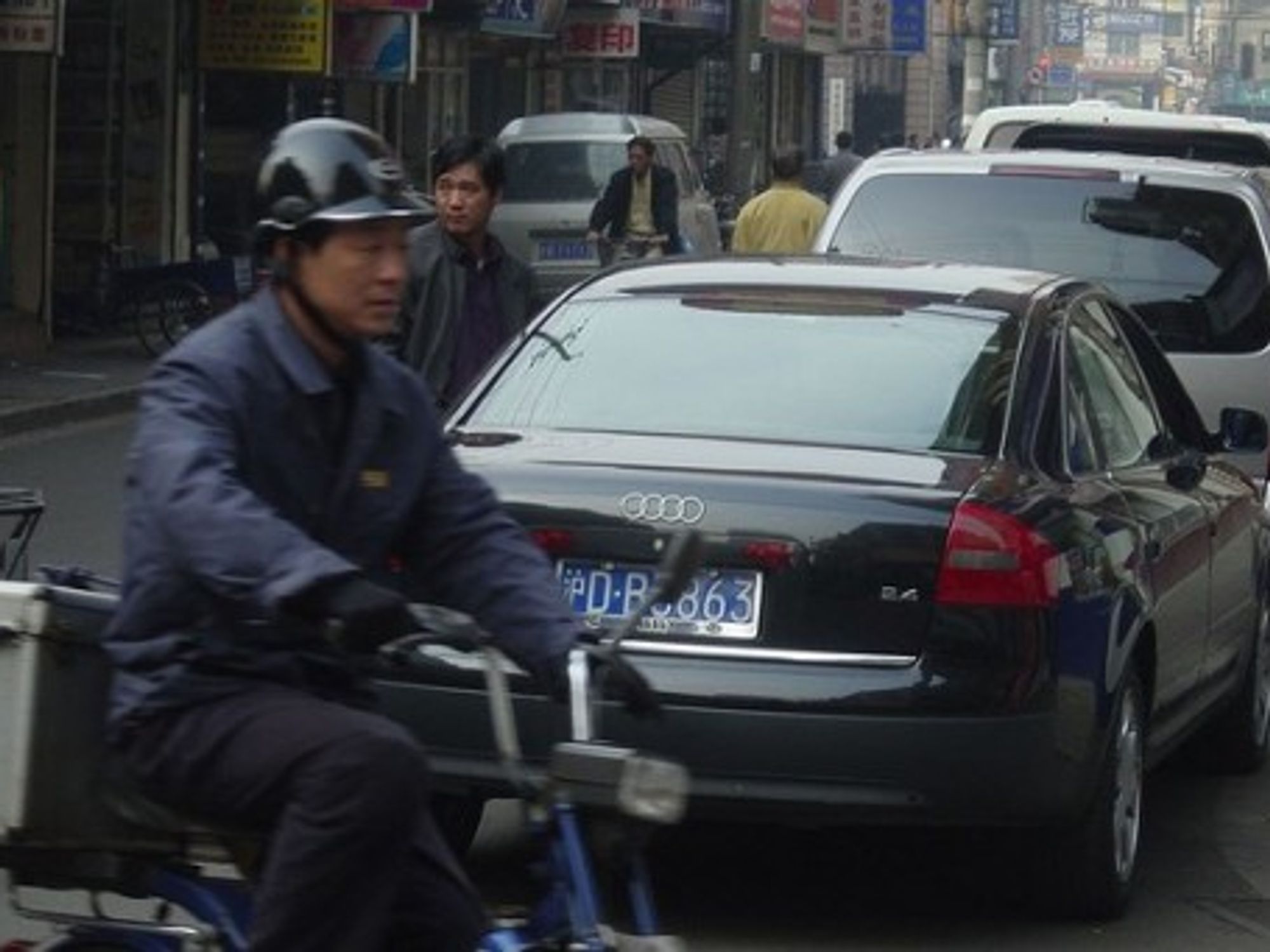 Different worlds collide in China's largest cities