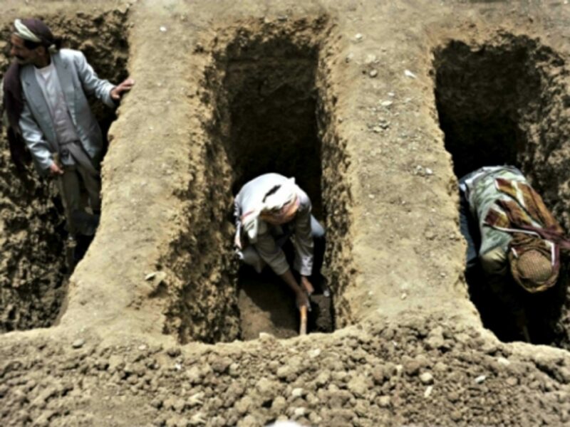 Digging graves after a Saudi airstrike in Yemen's Bani Matar district on April 4