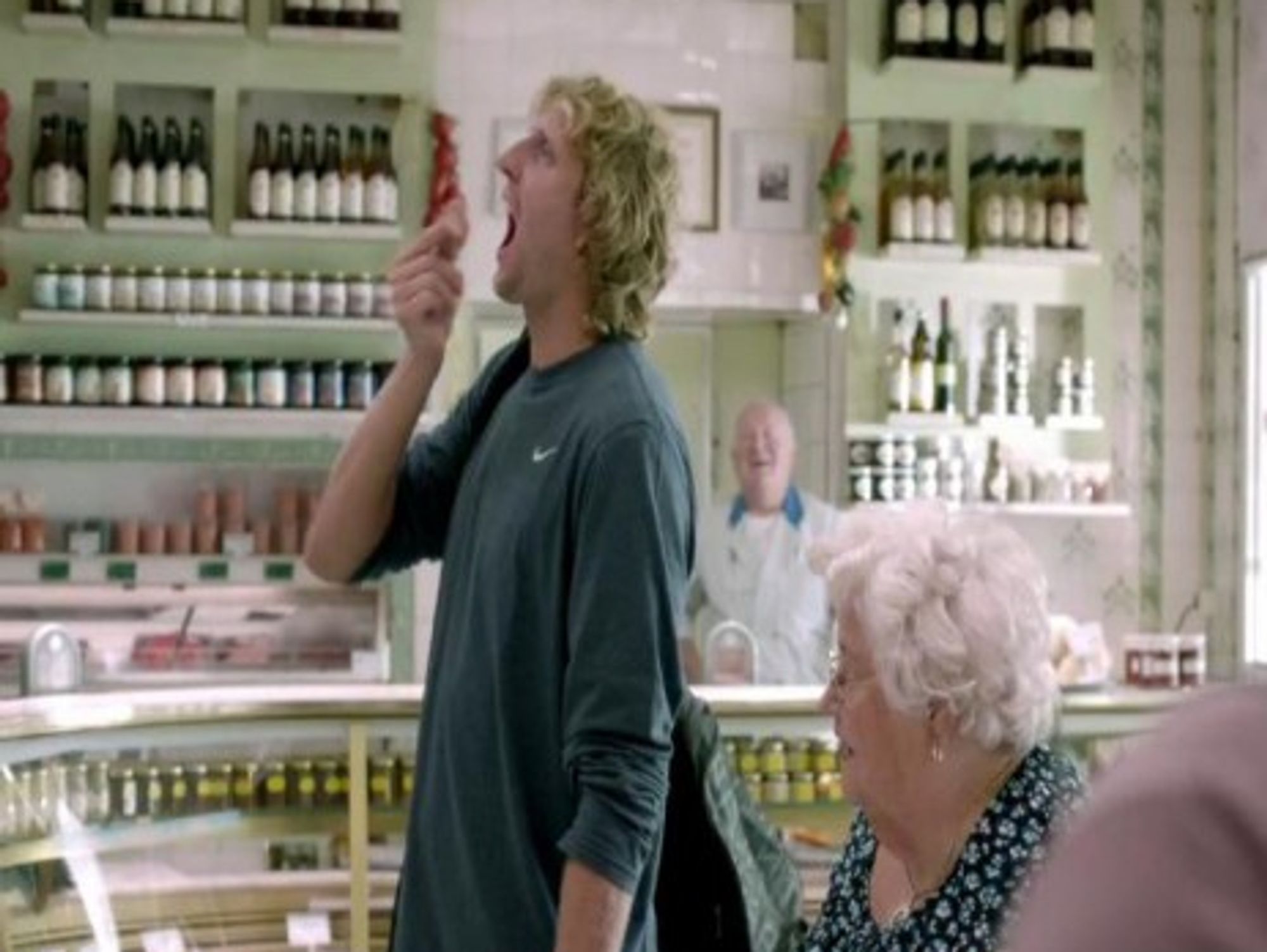 Dirk Nowitzki slam dunking a piece of sausage