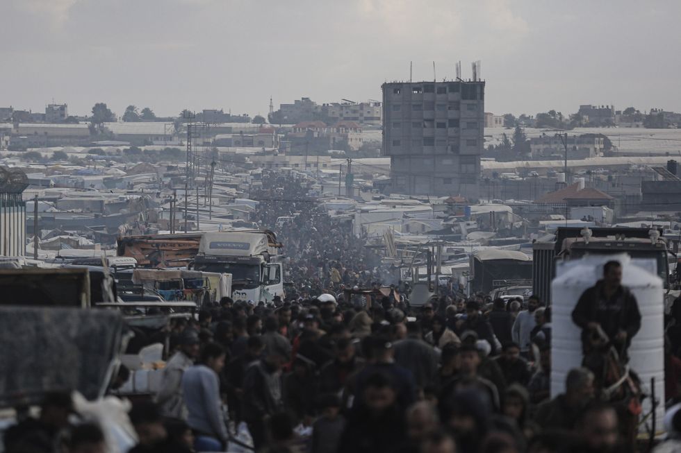 Displaced Palestinians are seen near the Gaza-Egypt border.