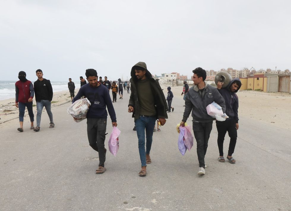 Displaced Palestinians flee from the area near Gaza City's al-Shifa hospital.