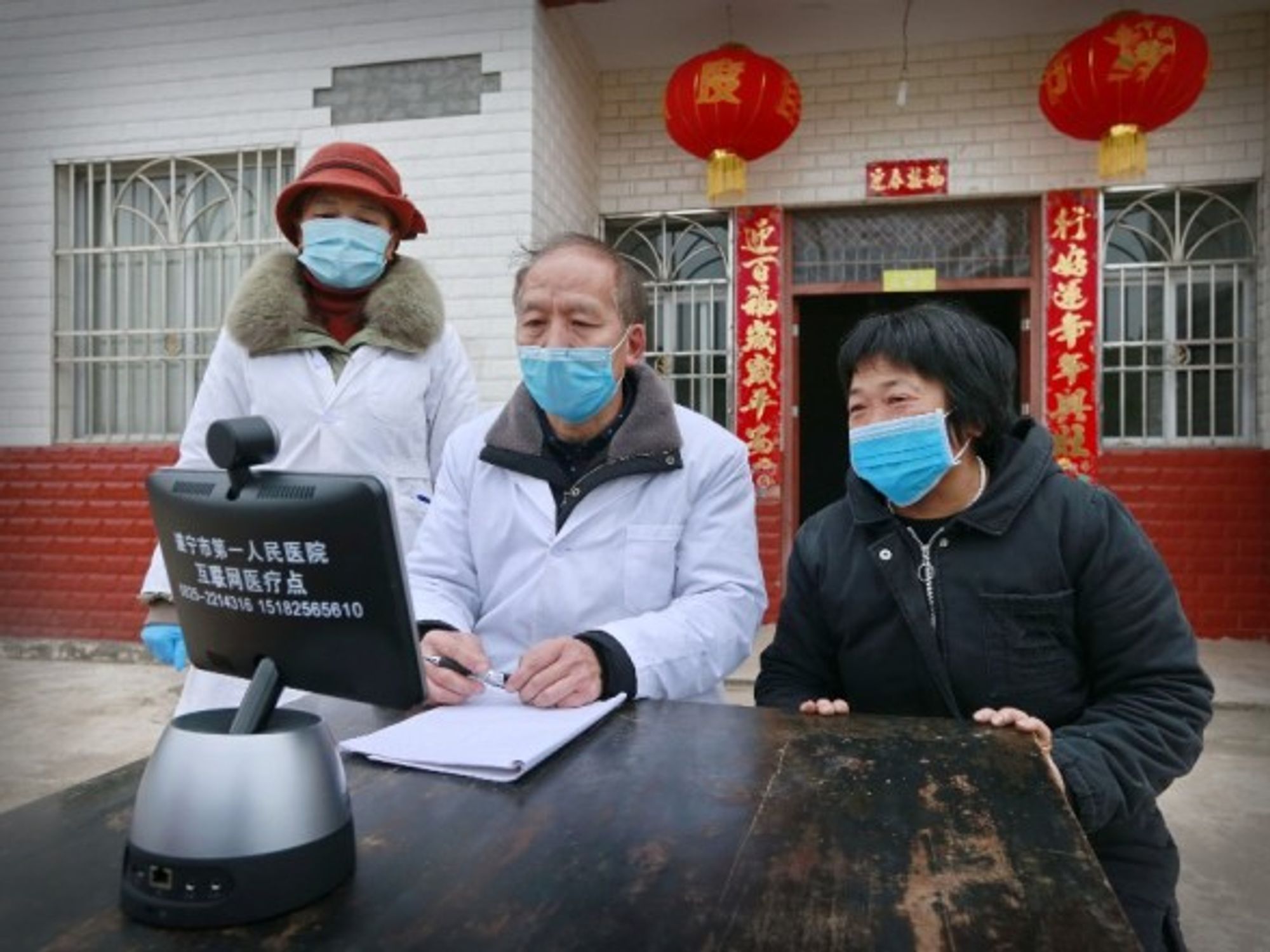Doctors holding consultations remotely with patients in Suining, China