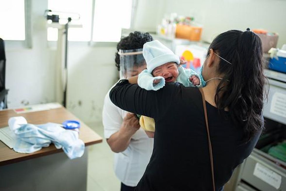 Doctors performing tests on newborn babies to protect them from Covid 19 in the Spring of 2020. Coatepec, Mexico