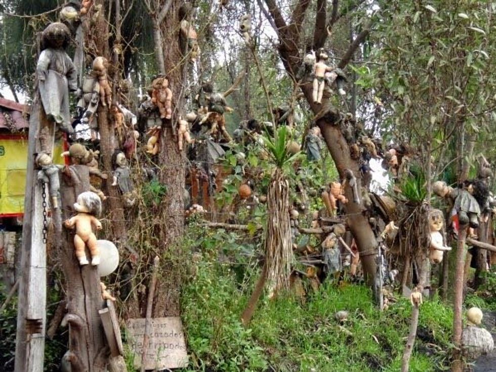 Dolls hanging on trees on Isla de las Munecas.