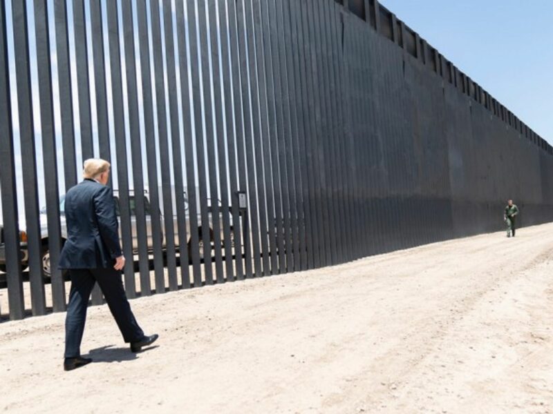 Donald Trump walking along the Mexican-American border