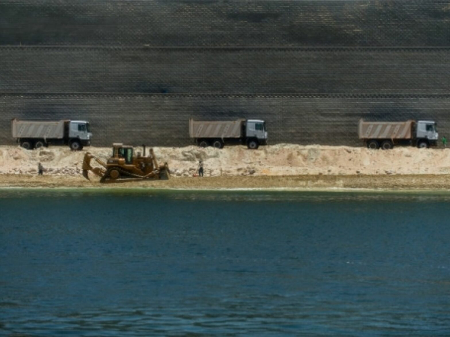 Dredging the extension of the Suez Canal.