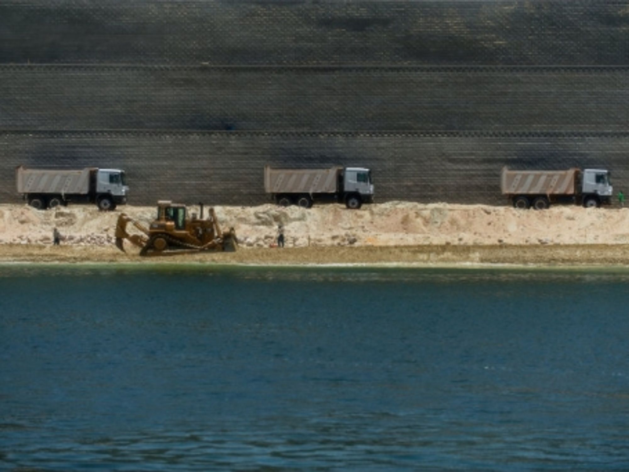 Dredging the extension of the Suez Canal.