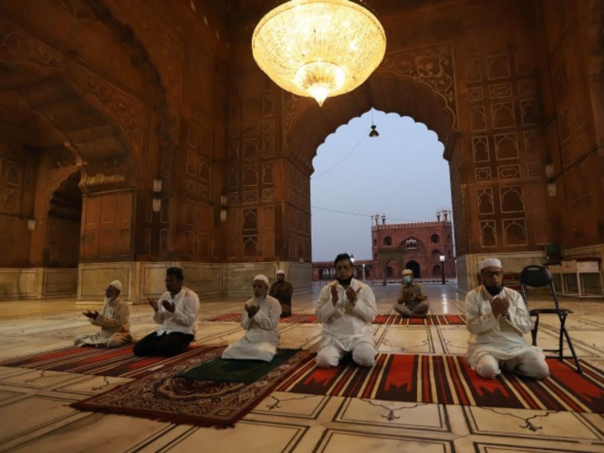 During Ramadan, Muslim men in New Delhi pray at a social distance from each other.