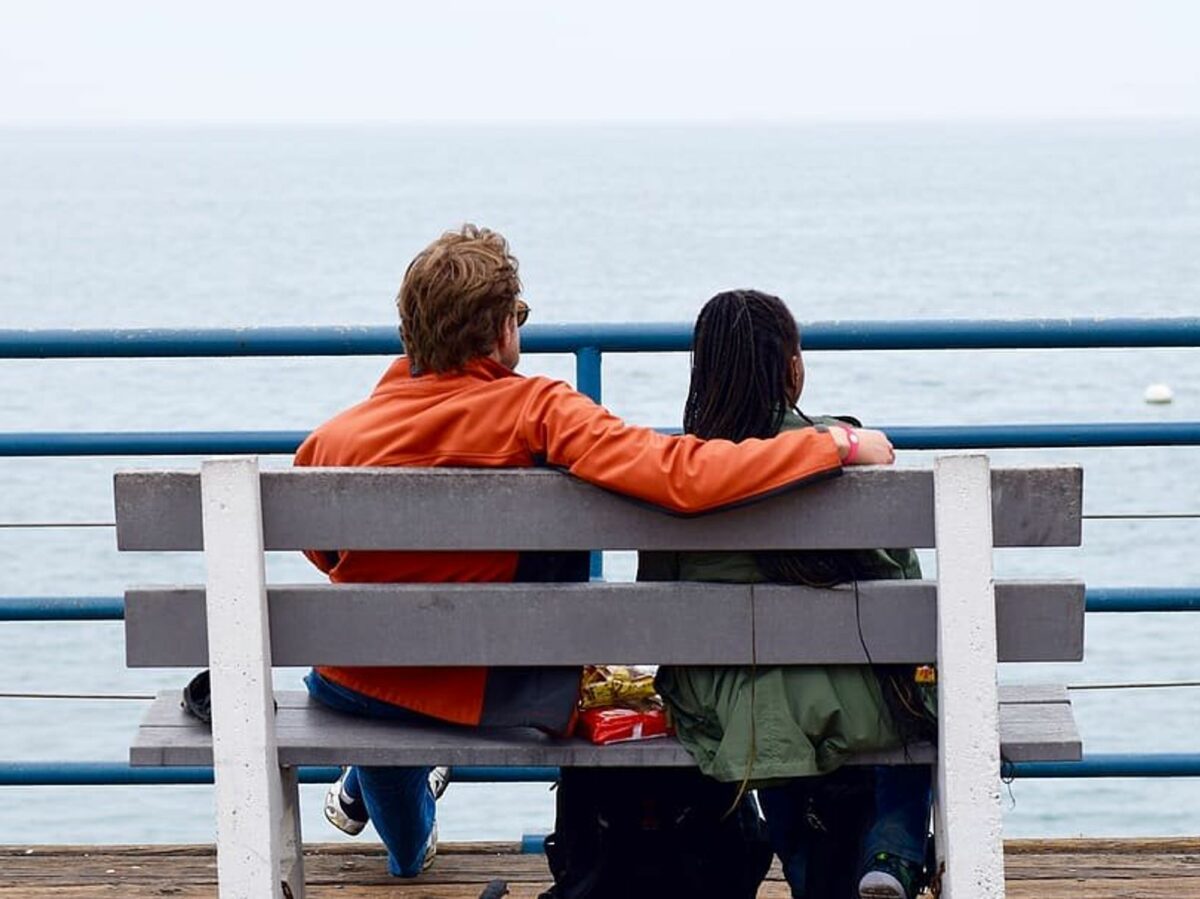 ​A couple looking at the beach.