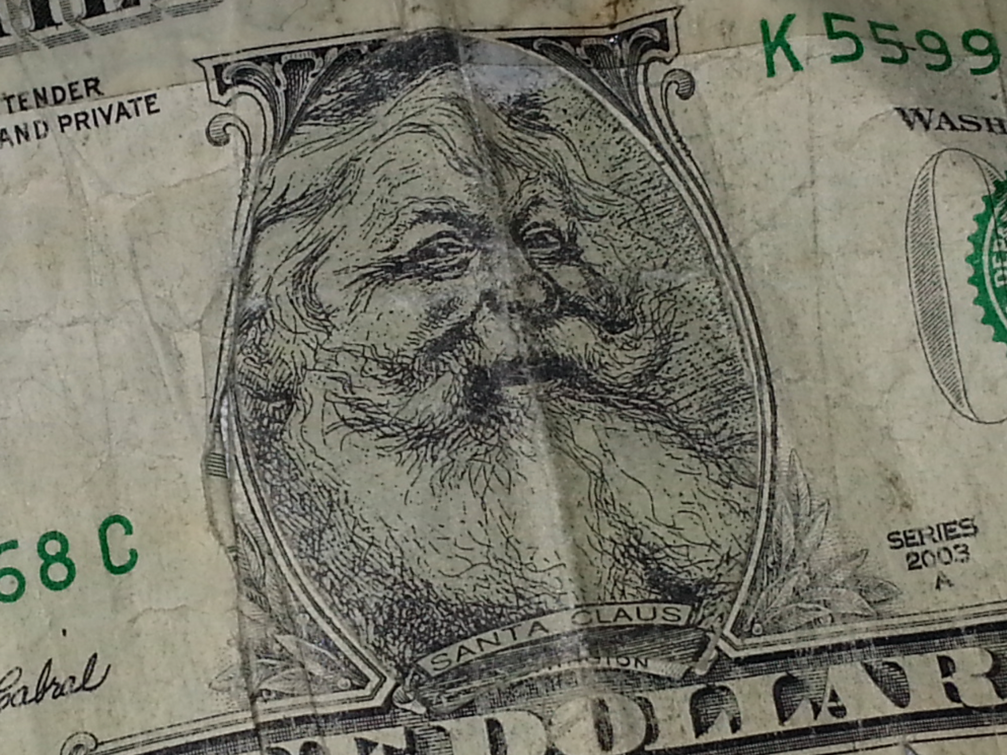 ​A fake dollar bill with Santa Claus' face.