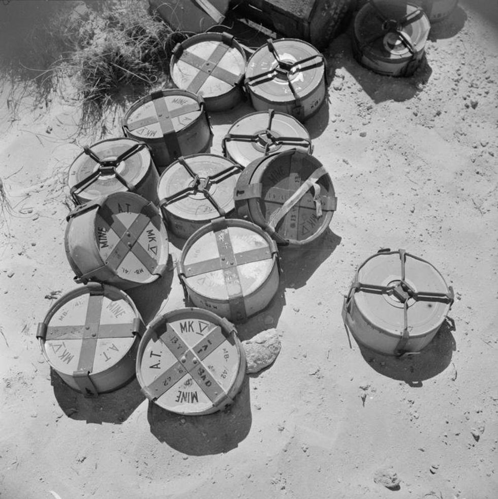 ​A group of Mk V mines about to be laid by South African sappers, Egypt, 2 July 1942.