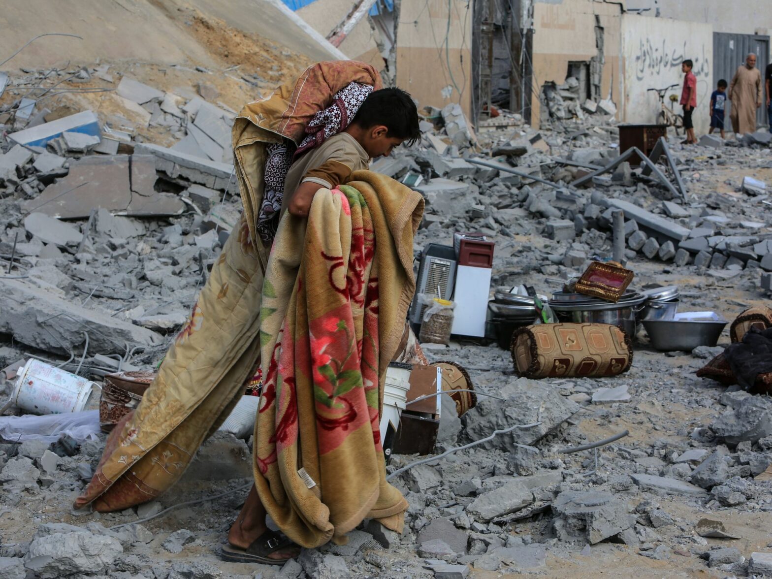 ​A Palestinian inspects a damaged house after Israeli warplanes bombed a home for the Al-Shaer family, leading to widespread destruction in the Al-Salam neighborhood.