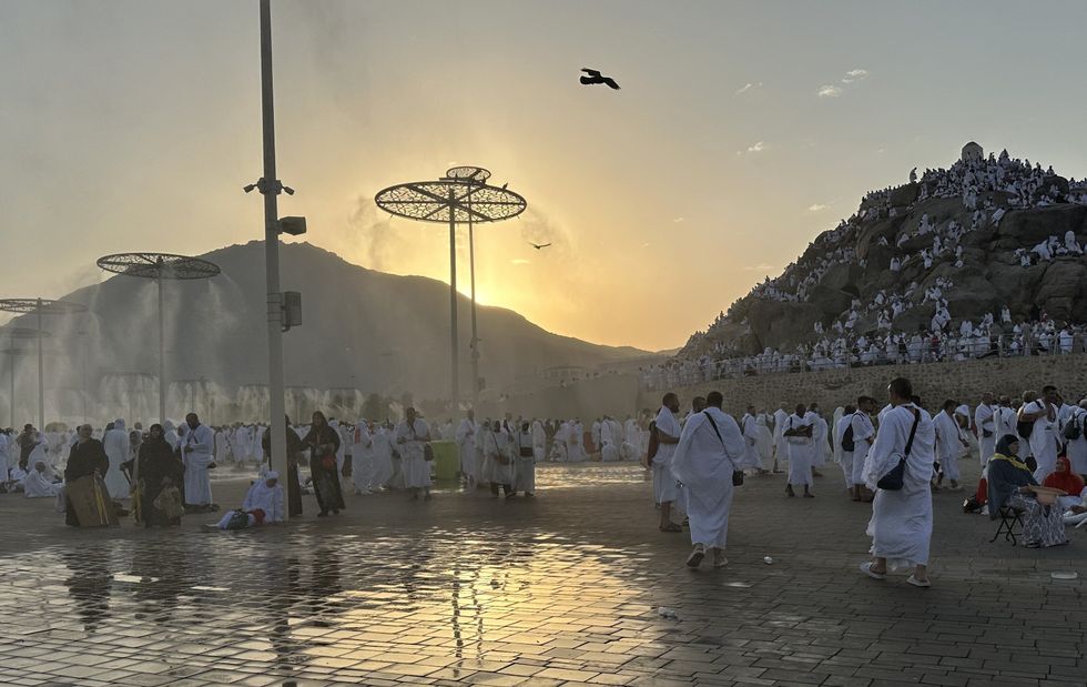 ​A photograph of Muslim pilgrims praying at dawn on Saudi Arabia's Mount Arafat during the Hajj pilgrimage.