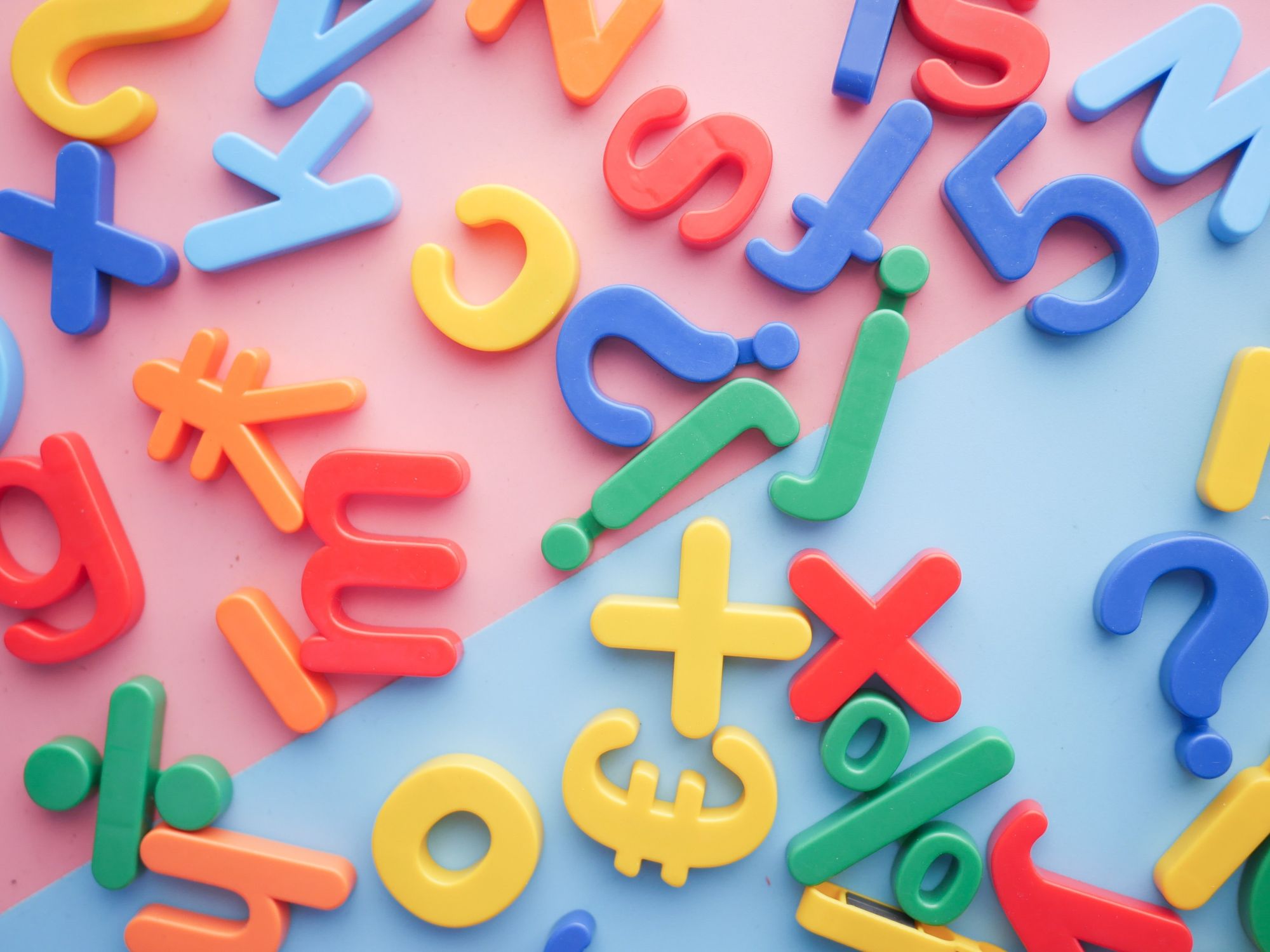 ​A pile of plastic letters and numbers