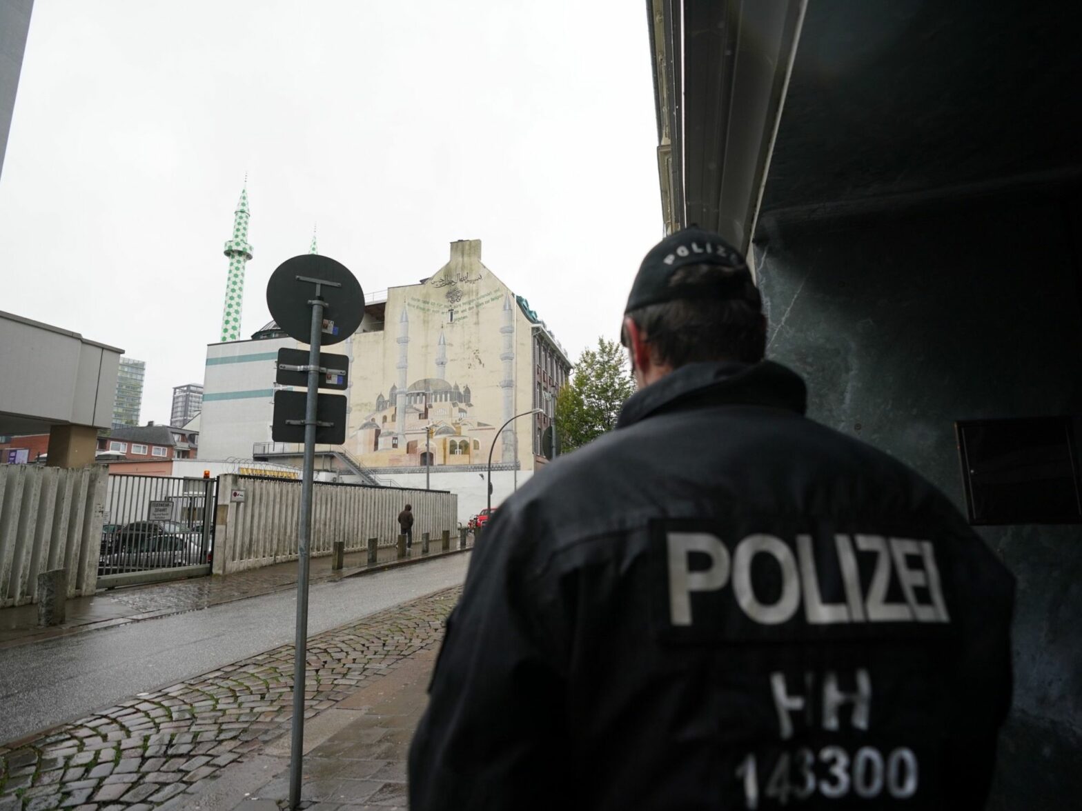 ​A policeman stands in front of the Centrum Mosque of the Islamic Community in Hamburg, Germany.