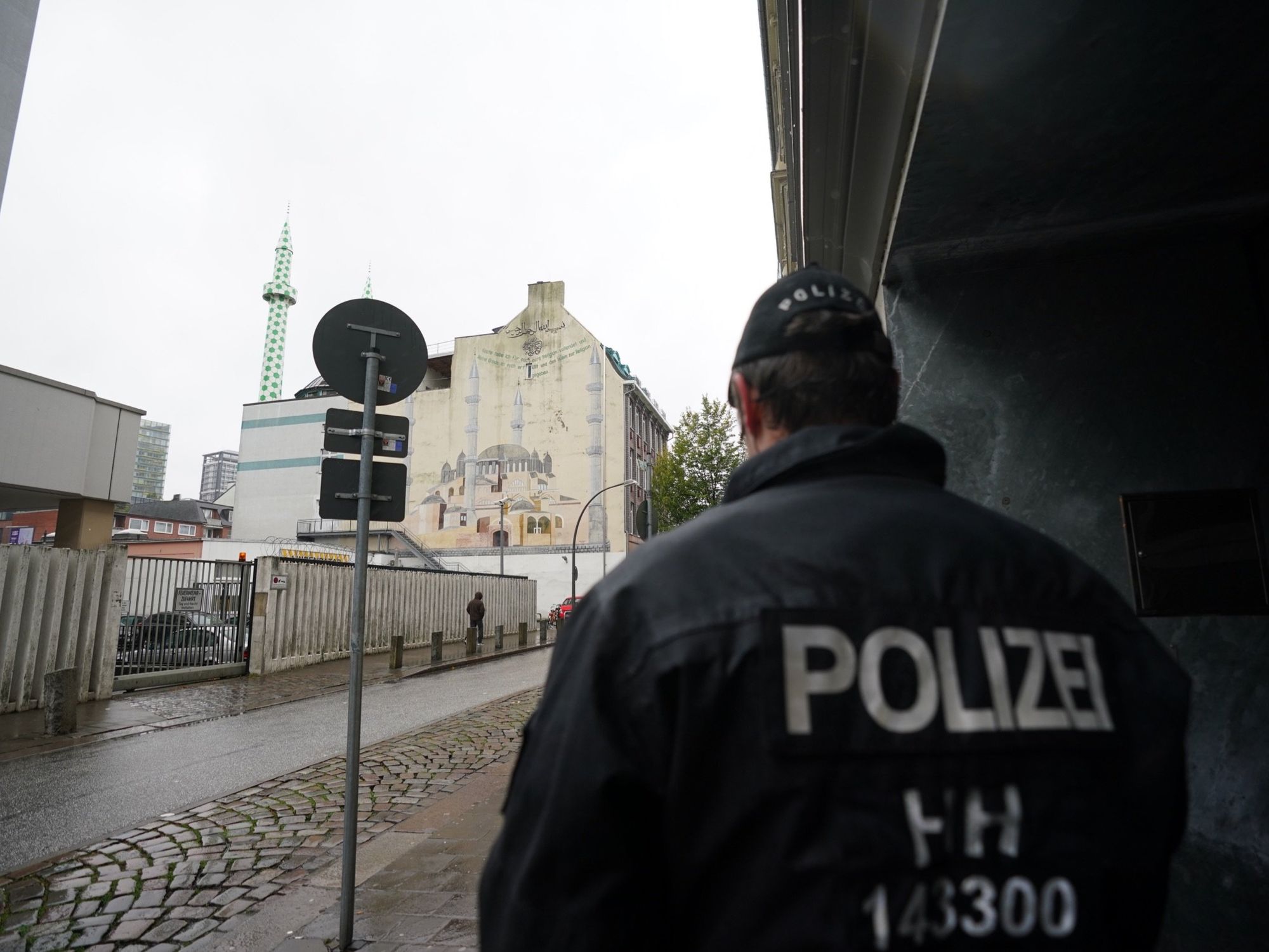 ​A policeman stands in front of the Centrum Mosque of the Islamic Community in Hamburg, Germany.