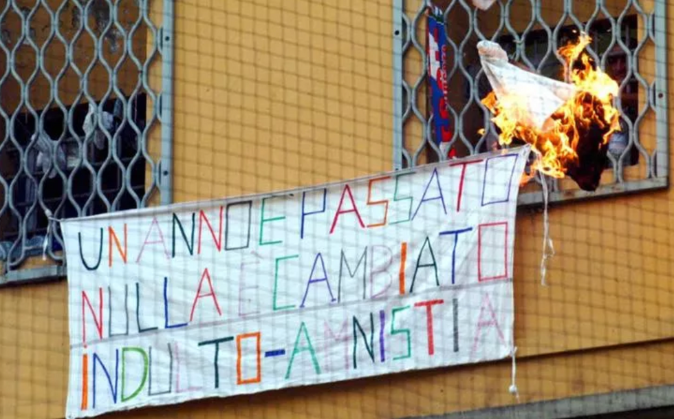 ​A sign outside Canton Mombello prison reading: "One year has passed, nothing has changed. Pardon-amnesty."